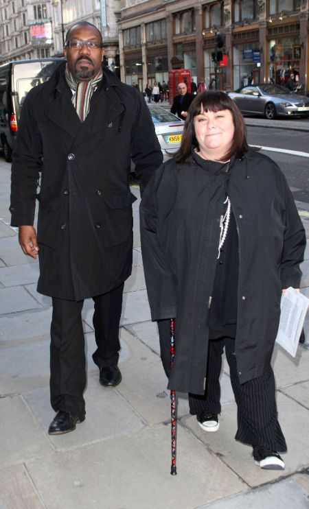 Comedian Dawn French in a black coat with former husband Lenny Henry.